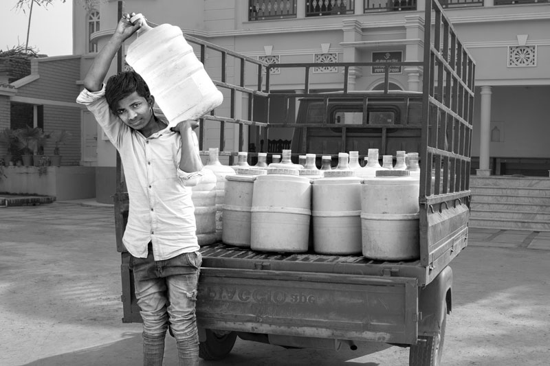 Impediments to enjoyment of Human Right to Water: 'Accessibility' Norm - Treated drinking water from a Reverse Osmosis (RO) plant being privately delivered for a price in a quality-affected village in Bhojpur district, Bihar